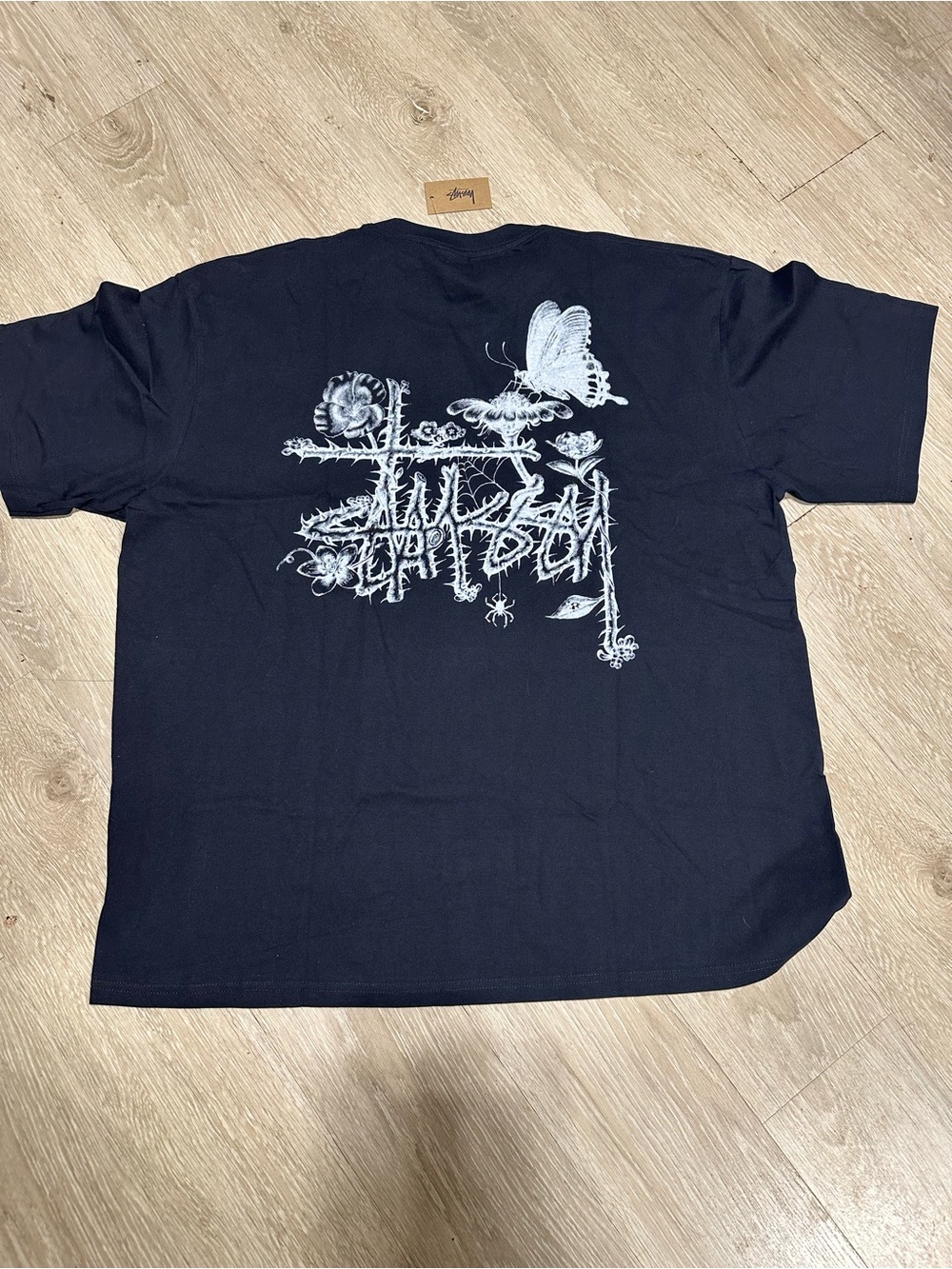Stussy Black Tee with White Botanical & Butterfly Back Graphic